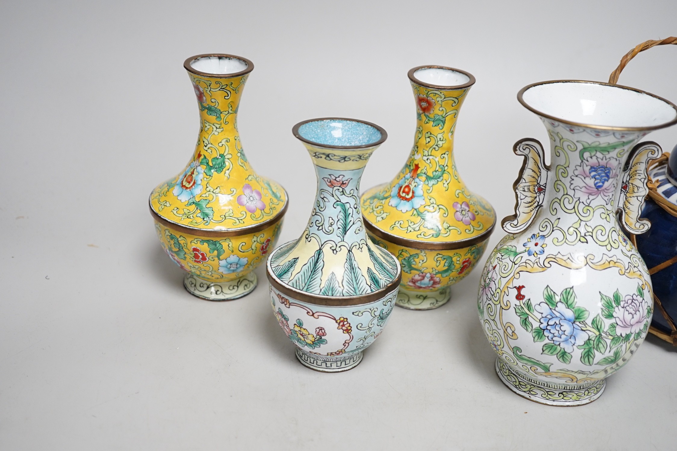 A group of Canton enamel vases, a pair of cloisonné enamel jars and a blue and white jar. Tallest 15.5cm